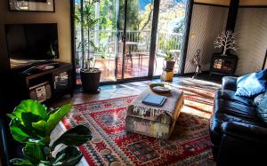 a living room with a couch and a coffee table at A Heavenly Escape in Halls Gap