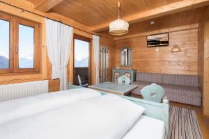 Postel nebo postele na pokoji v ubytování Hotel & Alpengasthof Pinzgerhof