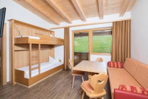 Postel nebo postele na pokoji v ubytování Hotel & Alpengasthof Pinzgerhof