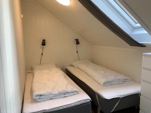 A bed or beds in a room at Solstrand Camping