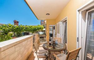 a balcony with a table and chairs on a balcony at Guesthouse Casa Nova in Poreč