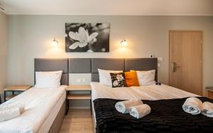 Łóżko lub łóżka w pokoju w obiekcie Al Mare - Apartamenty i pokoje