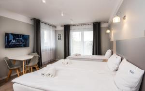 Łóżko lub łóżka w pokoju w obiekcie Al Mare - Apartamenty i pokoje