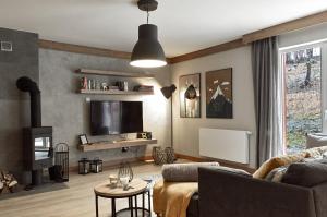 Telewizja i/lub zestaw kina domowego w obiekcie Między Nami Apartamenty