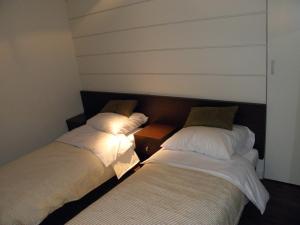 Łóżko lub łóżka w pokoju w obiekcie Villa & Spa