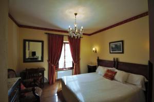 Postel nebo postele na pokoji v ubytování Hotel Rural Ovio
