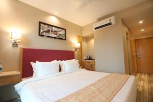Postel nebo postele na pokoji v ubytování Hotel Cliffton