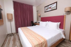 Postel nebo postele na pokoji v ubytování Hotel Cliffton