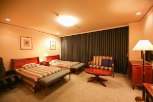 Postel nebo postele na pokoji v ubytování Hotel Marital Sousei Kurume + 25 fotografií