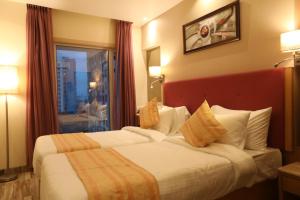 Postel nebo postele na pokoji v ubytování Hotel Cliffton