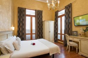 Postel nebo postele na pokoji v ubytování Navona Tower Relais