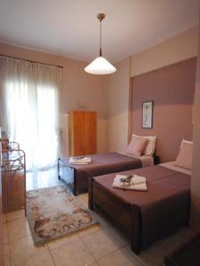 
Ein Bett oder Betten in einem Zimmer der Unterkunft Tenedos Home by TravelPro Services Halkidiki
