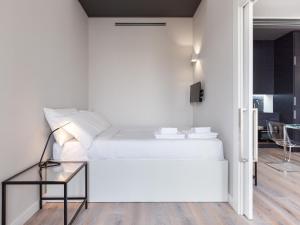 Ein Bett oder Betten in einem Zimmer der Unterkunft easyhomes-City Centre Suites