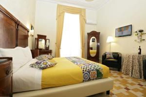 Postel nebo postele na pokoji v ubytování B&B Antonello da Messina