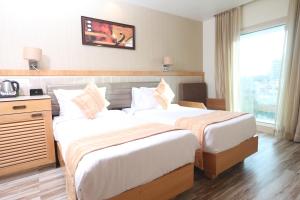 Postel nebo postele na pokoji v ubytování Hotel Cliffton