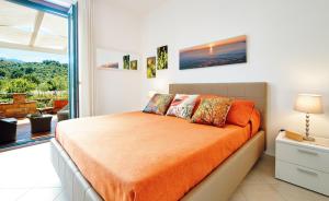 Un pat sau paturi într-o cameră la Cuore del Cilento Relais&Retreat