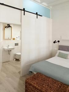 En eller flere senge i et værelse på Apartamento Loft-Cambados