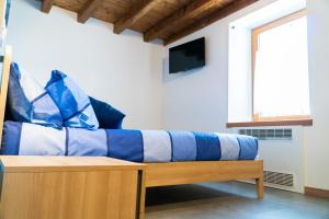 Postel nebo postele na pokoji v ubytování B&B Da Pieri