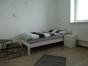 Tempat tidur dalam kamar di Apartmány Stdaniela