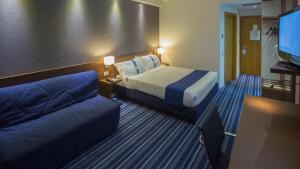 Posteľ alebo postele v izbe v ubytovaní GP Hotel