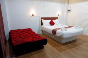 Postel nebo postele na pokoji v ubytování Namthip Residence