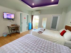 Postel nebo postele na pokoji v ubytování Namthip Residence + 37 fotografií