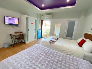 מיטה או מיטות בחדר ב-Namthip Residence