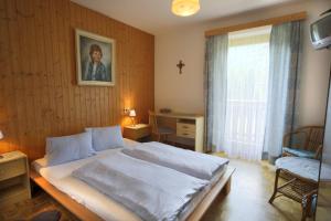 Postel nebo postele na pokoji v ubytování Gästehaus Lienharterhof