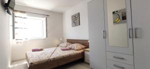 En eller flere senge i et værelse på Apartment Dolores