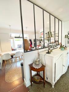 a living room with a white desk and a table at Xokoan in Biarritz