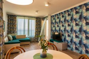 a living room with a couch and a table at Villa Flora in Sozopol
