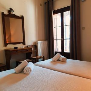 Posteľ alebo postele v izbe v ubytovaní Pegasus Hotel & Coastal Cafe