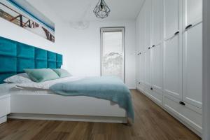 Postel nebo postele na pokoji v ubytování Resort Apartamenty Klifowa Rewal 36