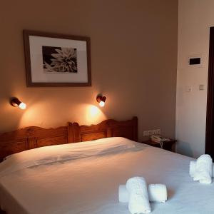 Postel nebo postele na pokoji v ubytování Pegasus Hotel & Coastal Cafe