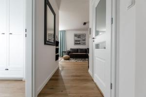 TV a/nebo společenská místnost v ubytování Resort Apartamenty Klifowa Rewal 36