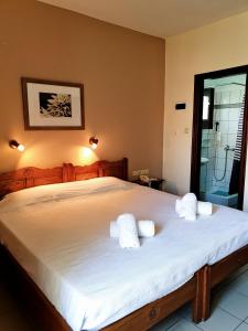 Postel nebo postele na pokoji v ubytování Pegasus Hotel & Coastal Cafe