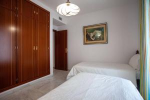 Posteľ alebo postele v izbe v ubytovaní Sanlucar Misericordia Centro
