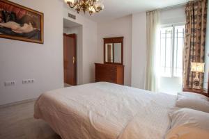 Posteľ alebo postele v izbe v ubytovaní Sanlucar Misericordia Centro