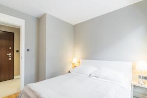 Posteľ alebo postele v izbe v ubytovaní Victoria Residence Apartments by Grand Apartments
