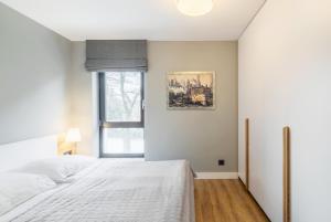 Posteľ alebo postele v izbe v ubytovaní Victoria Residence Apartments by Grand Apartments