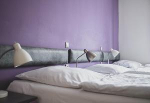 Postel nebo postele na pokoji v ubytování Cybulskiego Guest Rooms
