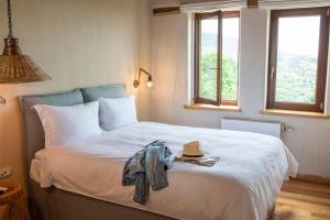 A bed or beds in a room at To Stefani tis Makrinas