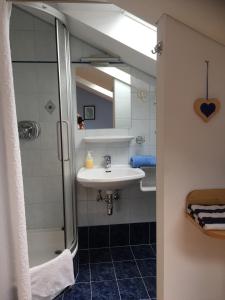 a bathroom with a sink and a shower at Gästehaus Huber in Arbesbach