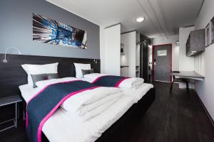 Cabinn Copenhagen客房内的一张或多张床位