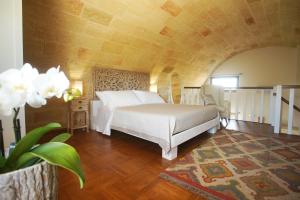 Ένα ή περισσότερα κρεβάτια σε δωμάτιο στο Relais L'Oliveto +177 φωτογραφίες
