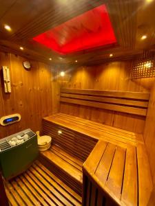 a sauna with a toilet and a red light at Hilldale Retreat in Nuwara Eliya +37 photos