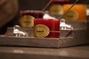 a candle on a counter with a sticker on it at Garni Hotel Wildanger in Zöblen +26 photos