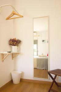 
a bathroom with a sink, toilet and a mirror at Villa Prana Guesthouse, Yoga & Ayurveda in Portimão
