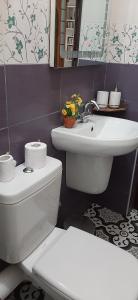 a bathroom with a white toilet and a sink at FUFA Haute standing appartment S2 center Monastir in Monastir +19 photos