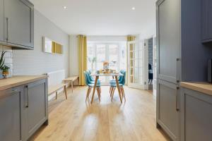 a kitchen with a table and chairs in a room at Listers Nest in Exley +12 photos